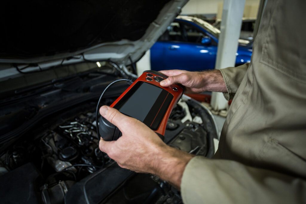 Hands Mechanic Using Diagnostic Tool 2